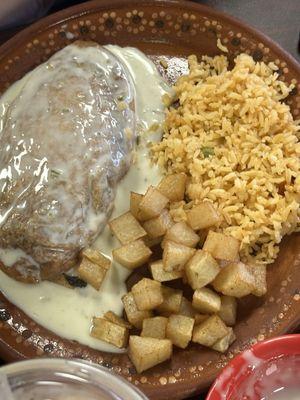 Chili relleno with potatoes and rice