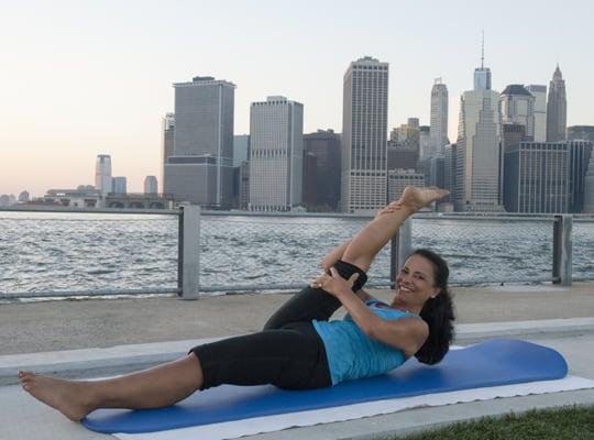 Lou teaching her Sunset Pilates class down at Pier 5 Brooklyn Bridge Park