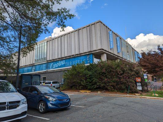 Outside UNC Student Stores. Storefront. View from parking lot.