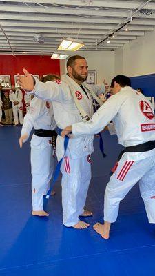 Coach Daniel receiving his blue belt.