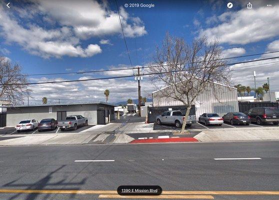 Pull up thru the Driveway. Parking in the Back. Shredding on the Right. Office to Pay on the Left.  1391 E Mission Blvd, Google Street View.