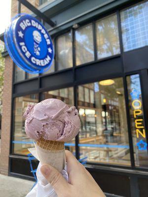 Huckleberry ice cream on a sugar cone