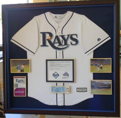 A customer brought this jersey in with photos of himself throwing the first pitch at a Ray's game.