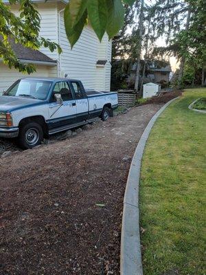 OMG... this had 2 big tall tree shrubs, 4 shrub stumps and TONS of weeds!  All GONE!!