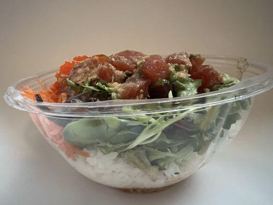 Build Your Own - Poke with tuna, rice, edamame, masago, spring mix, shredded carrots, and gluten free ginger miso dressing, on the side.