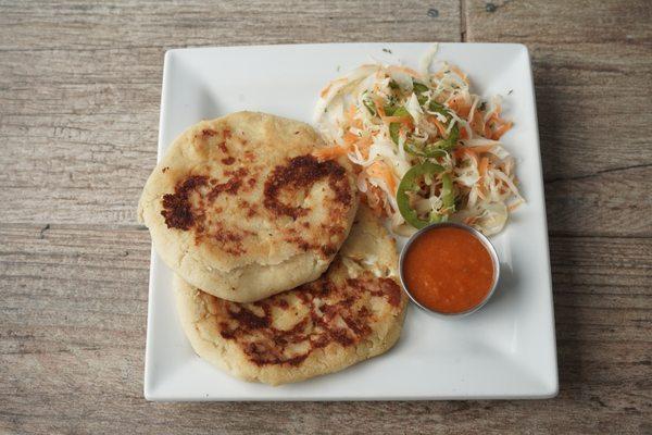 PUPUSAS 
from Salvador
cornmeal filled with mozzarella cheese, meat, refried beans. Accompanied with fermented cabbage slaw & tomato salsa