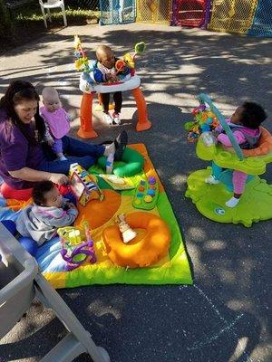 Infants enjoying fresh air.