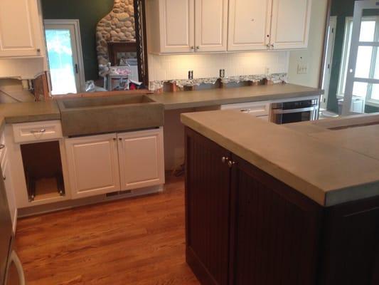 Concrete counter tops. With a custom sink all concrete natural