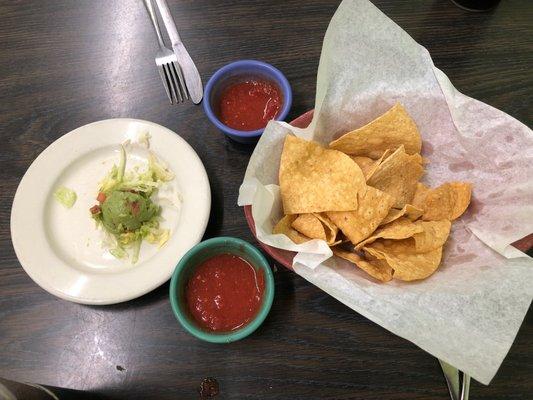 Warm tostada chips and salsa. We ordered guacamole for chili con carne burrito and taco plate.