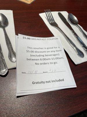 Vouchers toward the purchase of a breakfast entrée given to registered guests of Aladdin Inn next door.