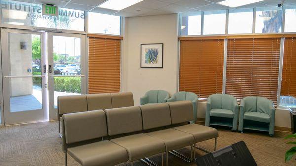 Cool waiting area with TV and water provided while you wait for your treatment.