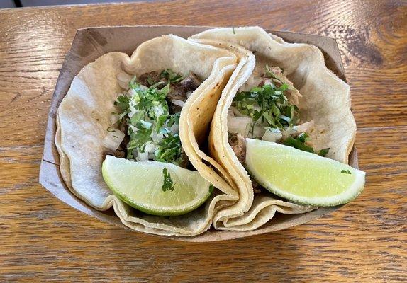 Traditional tacos - one steak , one pork carnitas