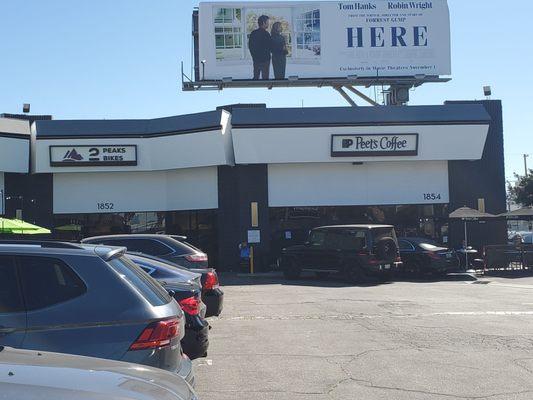 Right next to Peets coffee!  Genius!  Make sure to coffee up with a Dark Roast before 2 Peaks.