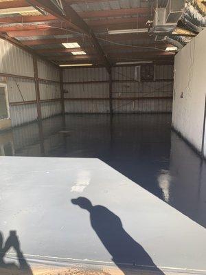 Picture of the floor the day before Kyle's team insulated our warehouse.