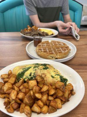 Spinach and feta omelette with the house potatoes. Also came with pancakes for a side.