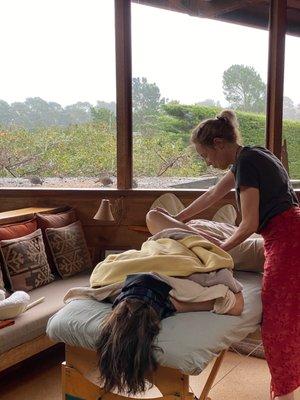 Couples Massage at Carmel Massage: Noel working on a female client while another massage therapist works on a male client.