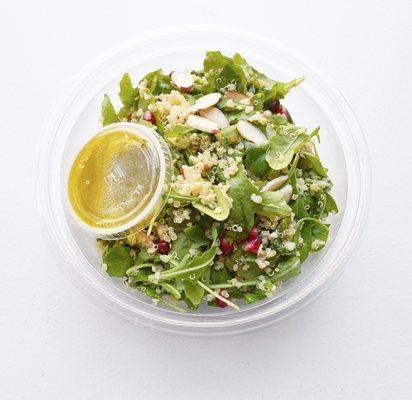 quinoa salad with arugula, pomegranate seed, slivered almond, extra virgin olive oil, lemon vinaigrette