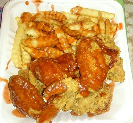 4 wings with fries mumbo sauce on everything.