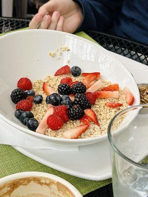 Oatmeal with fresh berries, granola and mascarpone