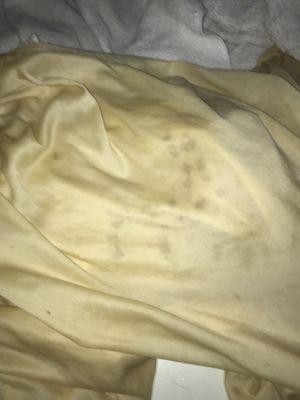 Mysterious spots all over my wedding gown after being cleaned.