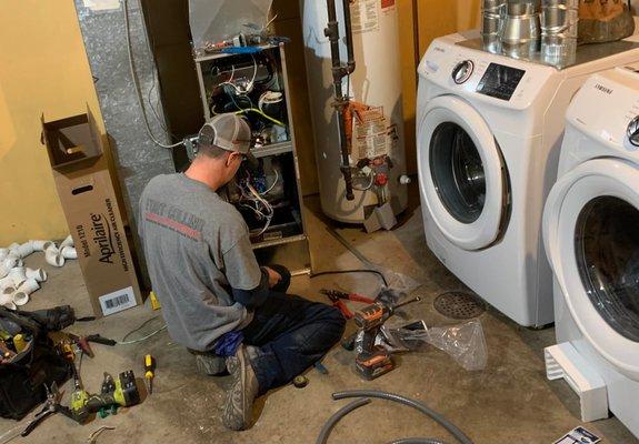 Installer, Kevin, Putting in Colleen's new furnace