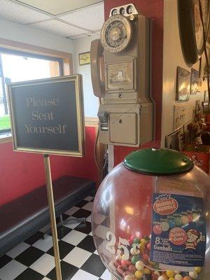 A gumball machine and a rotary dial pay phone? Smiles