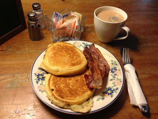 choc chip pancake with bacon on the side