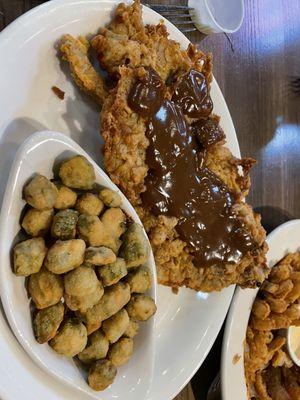 Chicken fried steak with mushroom gravy and okra.