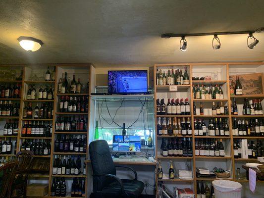 Wall full of wine and some NHL Playoffs while we ate our subs