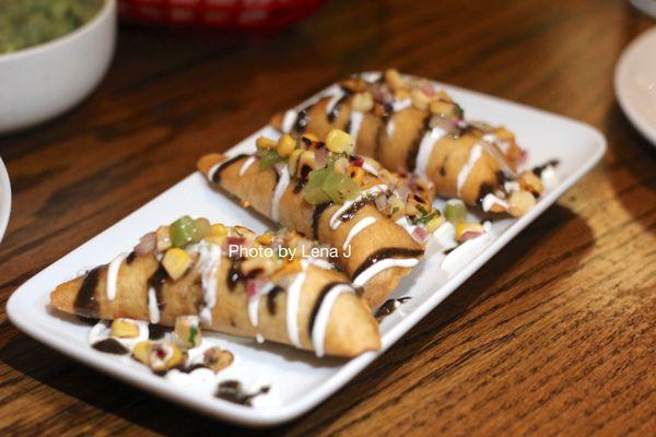 Forest Mushroom Empanadas ($14) - huitlacoche vinaigrette, tomatillo corn salsa, cheese, crema