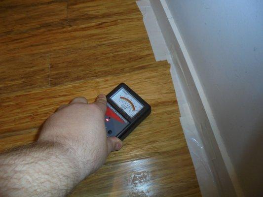 elevated moisture levels in wood over concrete floor system