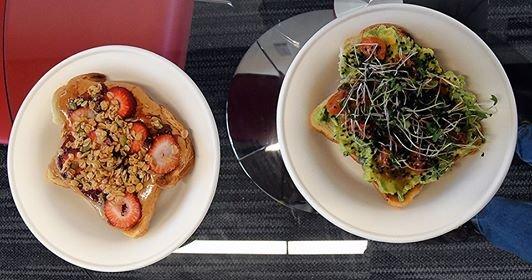 (L) PB&J Toast: Sliced fruit covered with granola. (R) Classic Avo: Avo mash, seared tomatoes, micro-greens, sesame seeds.