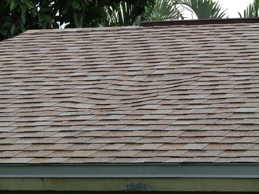 Dip in roof on the front of the house.