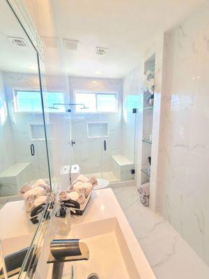 Custom made glass shelving in the wall & shower door