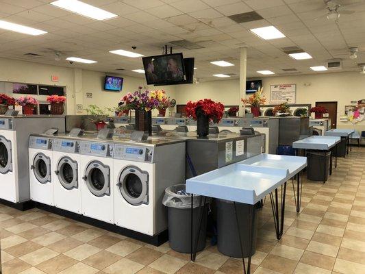 50 washers in different capacities. 6 TVs with cable channels and folding tables