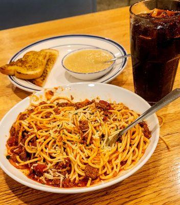 12/6/23 spaghetti homemade meat sauce. My kind minimal onion easy to pick out. Side Choice applesauce garlic toast D. Coke