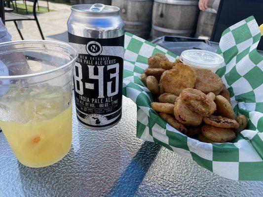 Fried pickles, mixed drink, and beer