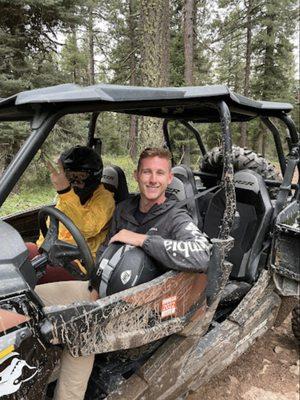 Happy customers after a fun, but muddy ride.