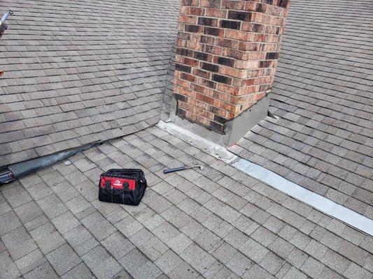 The chimney was improperly flashed a d conjunction with the valley/lowslope tie in. It was a mess