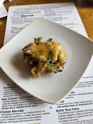 Piggy potato skins Topped with a tangy Carolina sauce, pulled pork, mashed potatoes, green onions and melted cheese