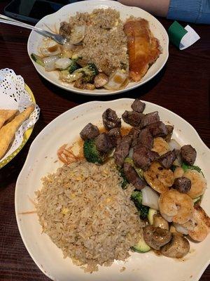 Steak, shrimp, and salmon hibachi with fried rice and vegetables.