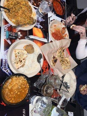 Chan a masala bottom left, Lamb biryani top left and butter chicken top right