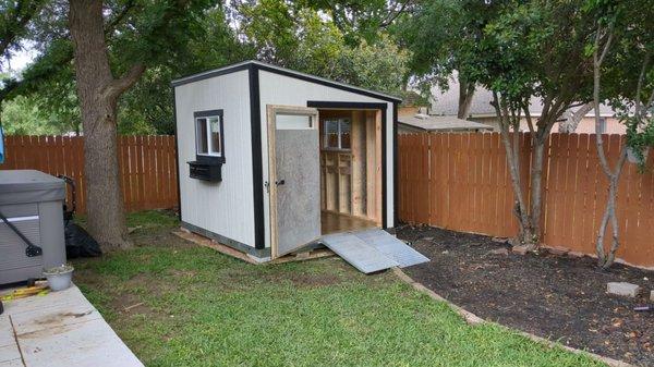 LEAN-TO STYLE 8X10 WITH EXTRA LARGE DOOR.