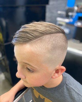 High skin fade with undercut and hard part by Sarah