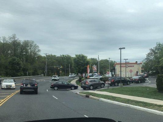 Someone is going to get killed here. Every day this is Iike this. Left turn over double yellow blocking lanes.