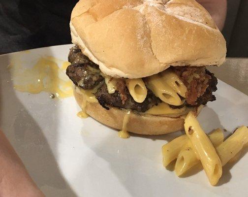 Mac-n-cheese burger sprinkled with bacon bits.