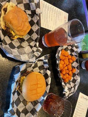 On the left is a DJ Goomba with American cheese, and on the right is a Josey Wales. we also had sweet potato tots.