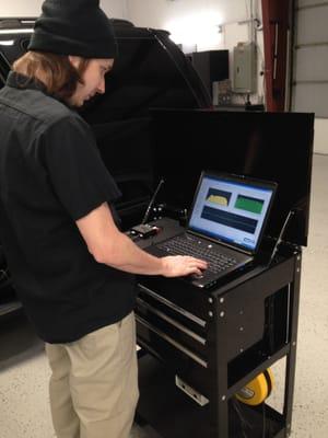 Our Mechanicsville tech Chris tuning a vehicle's sound system