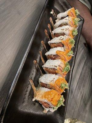 Toro on fire: Spicy Chu toro, cucumber, tempura flakes, lightly seared tuna, ponzu, wasabi aioli, sriracha. (As described on menu)