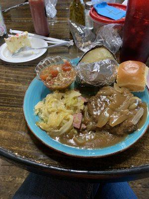 The Special!  Hamburger steak with onion gravy, fried cabbage, stewed okra and tomatoes, baked potatoe, dinner roll, and a piece of cake